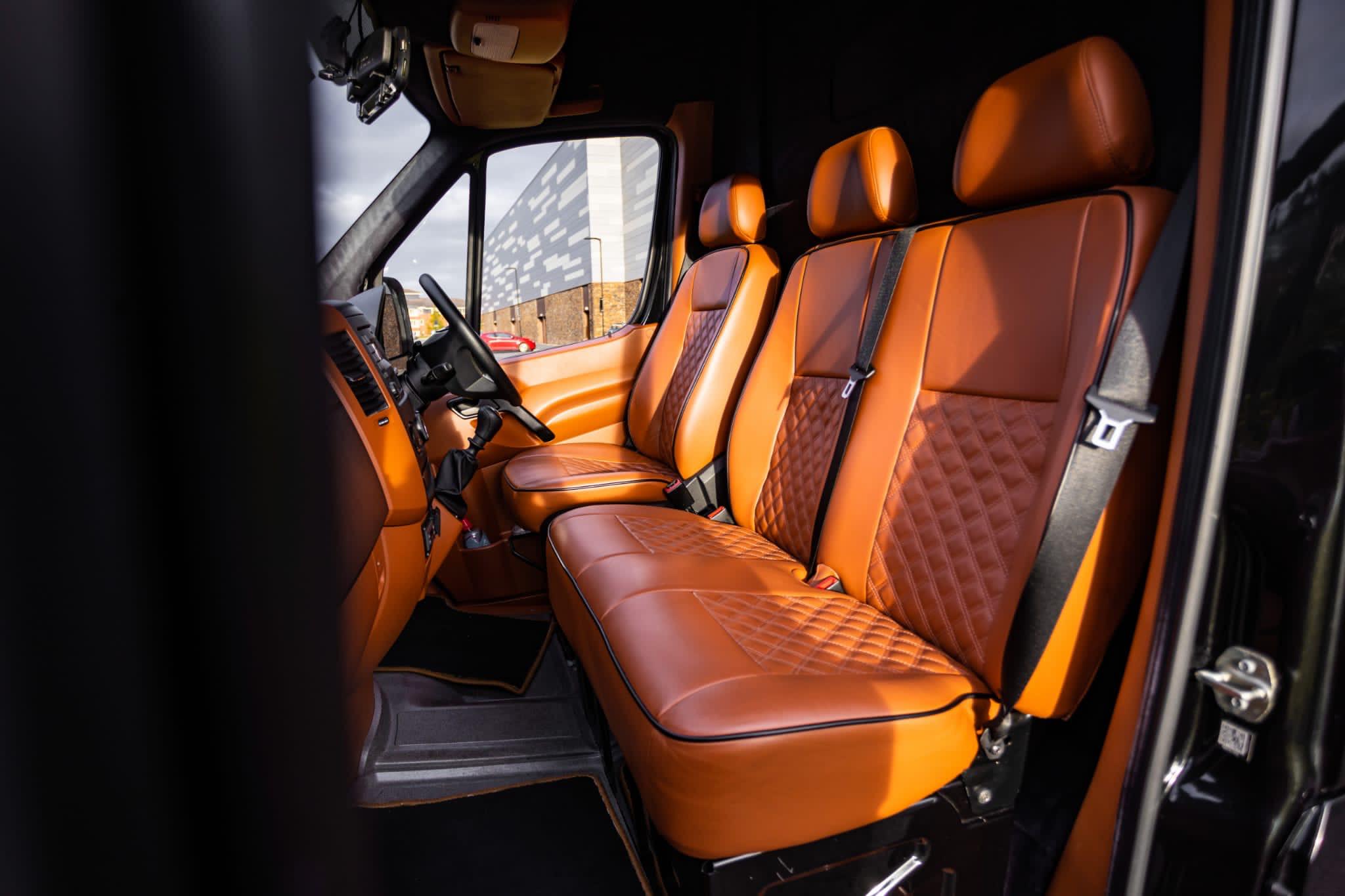 Cognac quilted leather captain's seats — van cab